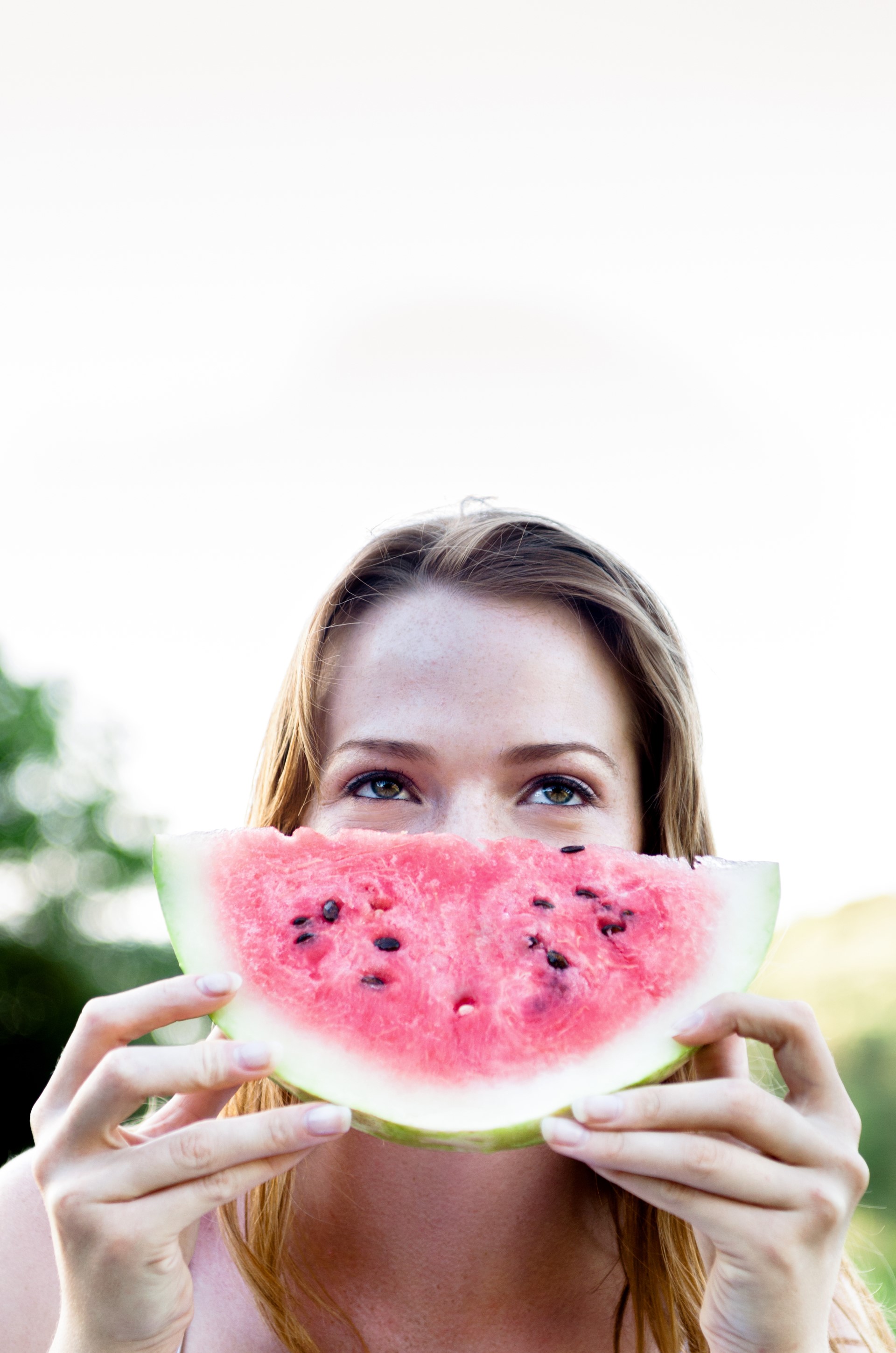 Pretty happy cute woman eating slice of juicy red watermelon out -  Matterhorn Blog